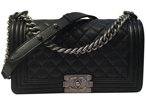 Chanel Medium Caviar Boy Bag .